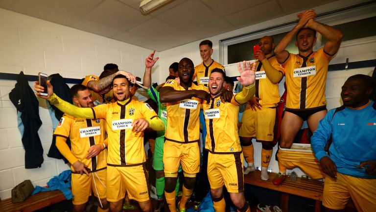 Sutton United players celebrate after knocking AFC Wimbledon out of the FA Cup