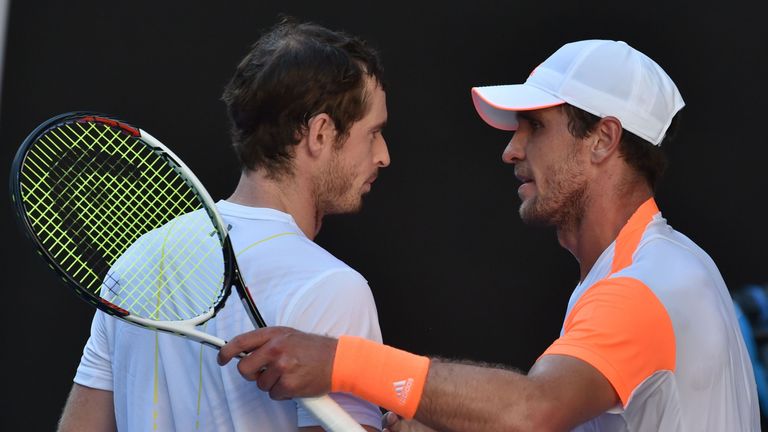 Germany's Mischa Zverev (R) shakes hands with Britain's Andy Murray after winning their men's singles fourth round match at the Australian Open