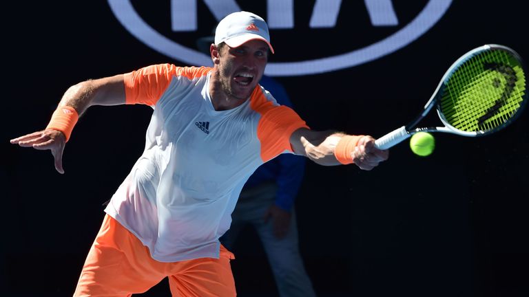 Germany's Mischa Zverev hits a return against Britain's Andy Murray during their men's singles fourth round match on day seven of the Australian Open