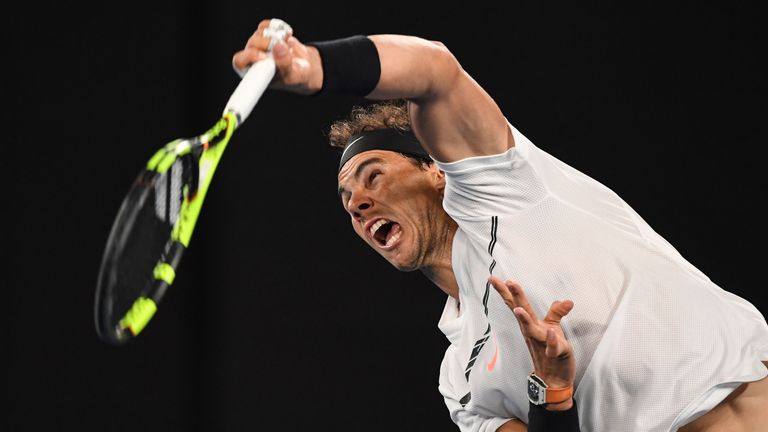 Rafael Nadal serves against Grigor Dimitrov during their Australian Open semi-final