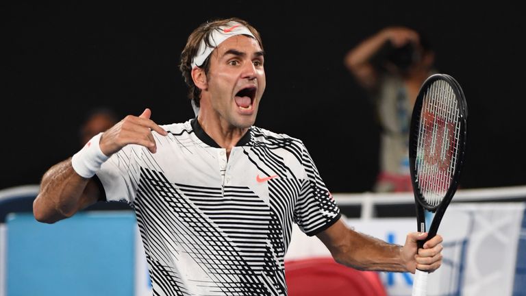 Roger Federer celebrates his victory against Kei Nishikori during their men's singles fourth round match on day seven of the Australian Open