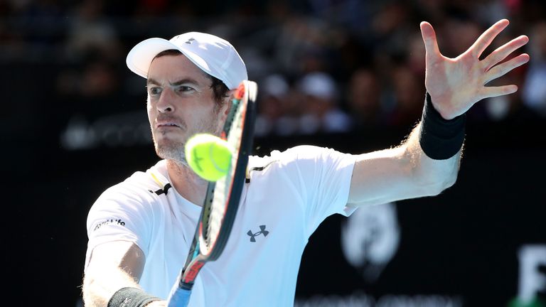 Andy Murray of Great Britain plays a backhand in his third round match against Sam Querrey of the United States
