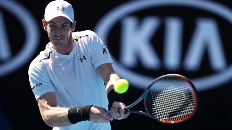 Andy Murray of Great Britain plays a backhand in his first round match against Illya Marchenko of the Ukraine
