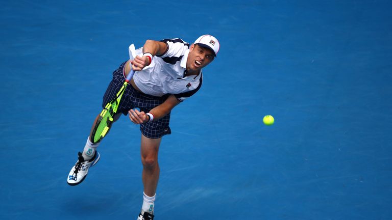 Sam Querrey of the United States serves in his third round match against Andy Murray of Great Britain