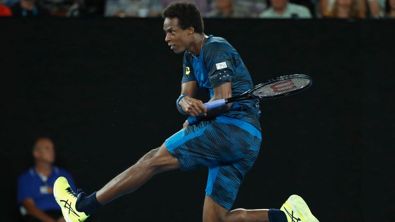 MELBOURNE, AUSTRALIA - JANUARY 23:  Gael Monfils of France plays a forehand in his fourth round match against Rafael Nadal of Spainon day eight of the 2017