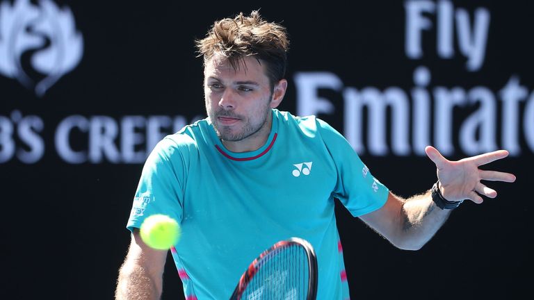 Stan Wawrinka of Switzerland plays a backhand in his third round match against Viktor Troicki of Serbia