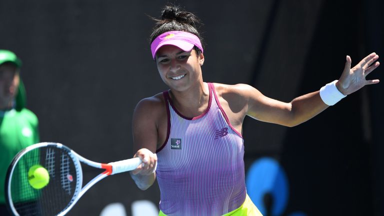 Britain's Heather Watson hits a return against Jennifer Brady of the US during their women's singles second round match on day four of the Australian Open 