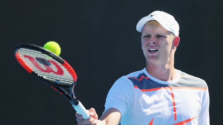 Kyle Edmond of Great Britain gathers a ball during a practice session ahead of the 2017 Australian Open