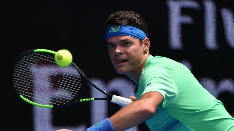 Milos Raonic of Canada hits a return against Dustin Brown of Germany during their men's singles match on day two of the Australian Open