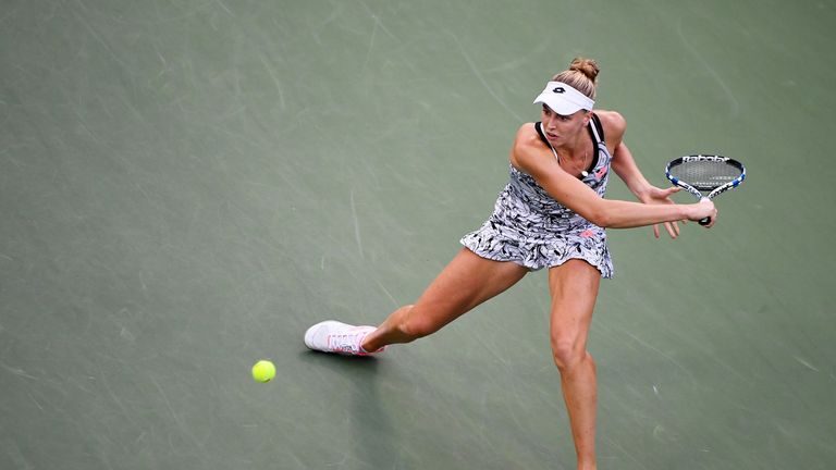 Naomi Broady returns a shot to Agnieszka Radwanska during her second round Women's Singles match