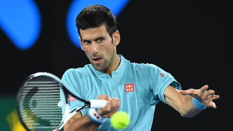 Serbia's Novak Djokovic hits a return against Spain's Fernando Verdasco during their men's singles match on day two of the Australian Open