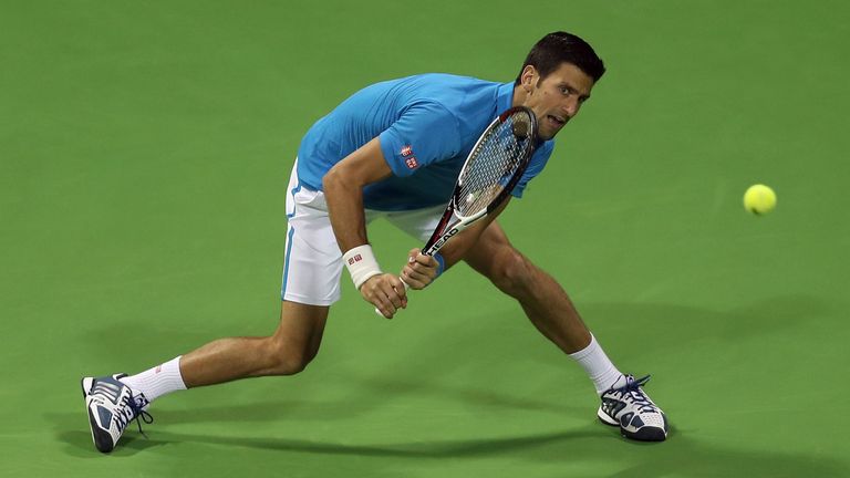 Serbia's Novak Djokovic returns the ball to Jan-Lennard Struff of Germany, during the ATP Qatar Open tennis competition in Doha