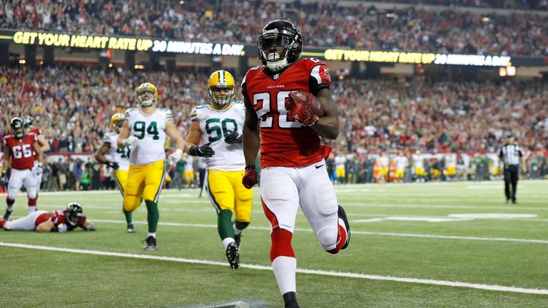 ATLANTA, GA - JANUARY 22: Tevin Coleman #26 of the Atlanta Falcons scores a three yard touchdown in the fourth quarter against the Green Bay Packers  in th