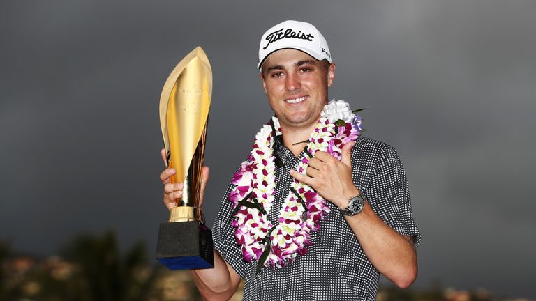 Justin Thomas of the United States celebrates with the trophy after winning the Sony Open In Hawaii at Waialae Country Club on 