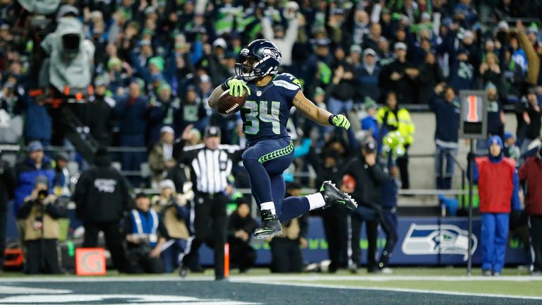 SEATTLE, WA - JANUARY 07:  Thomas Rawls #34 of the Seattle Seahawks scores a 4-yard touchdown during the fourth quarter against the Detroit Lions in the NF