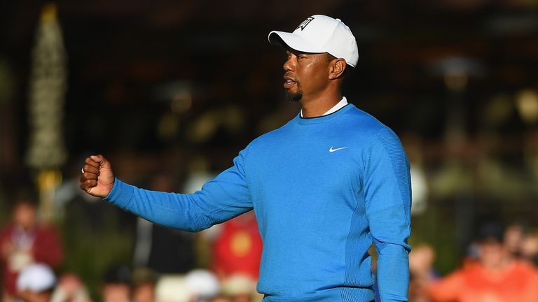 SAN DIEGO, CA - JANUARY 26:  Tiger Woods reacts to his putt on the 18th hole during the first round of the Farmers Insurance Open at Torrey Pines South on 