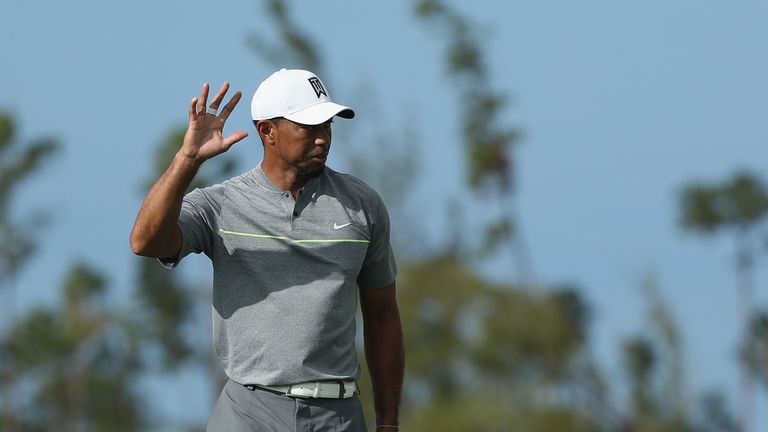 NASSAU, BAHAMAS - DECEMBER 03:  Tiger Woods of the United States waves after putting on the 11th hole during round three of the Hero World Challenge at Alb