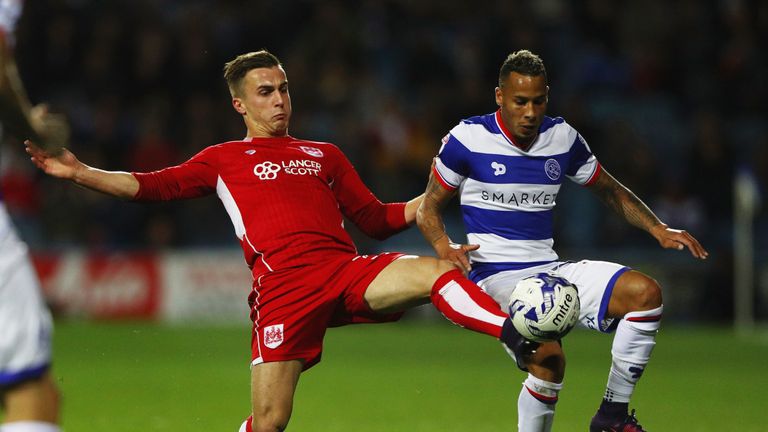 LONDON, ENGLAND - OCTOBER 18:  Tjaronn Chery of Queens Park Rangers is tackled by Joe Bryan Bristol City during the Sky Bet Championship match between Quee