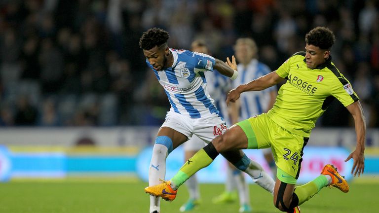 Huddersfield Town's Kasey Palmer (left) is tackled by Rotherham United's Tom Adeyemi during the Sky Bet Championship match at the John Smith's Stadium, Hud