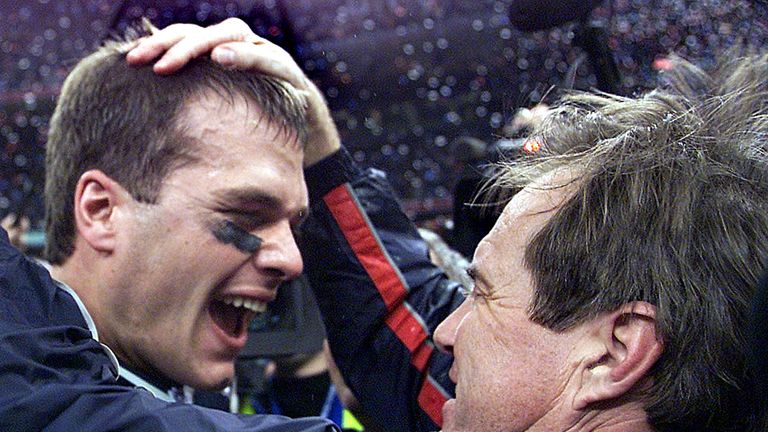 NEW ORLEANS, UNITED STATES:  New England Patriots' quarterback Tom Brady celebrates with head coach Bill Belichick (R) after their win over the St. Louis R