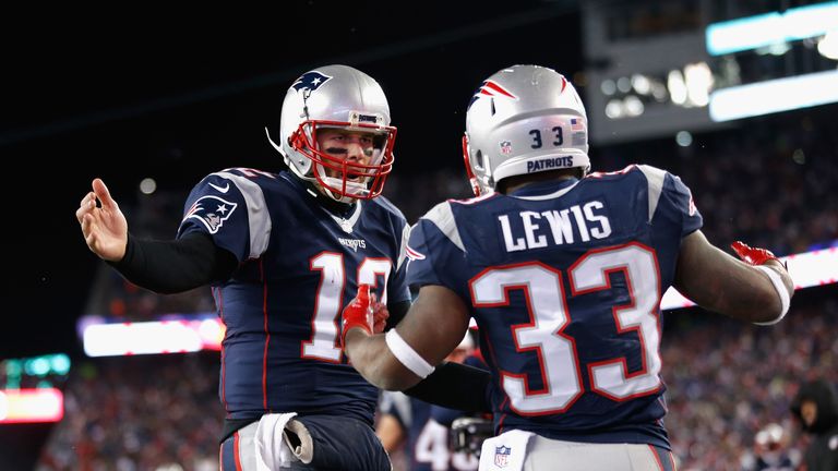 FOXBORO, MA - JANUARY 14: Dion Lewis #33 celebrates with Tom Brady #12 of the New England Patriots after scoring a touchdown in the fourth quarter during t