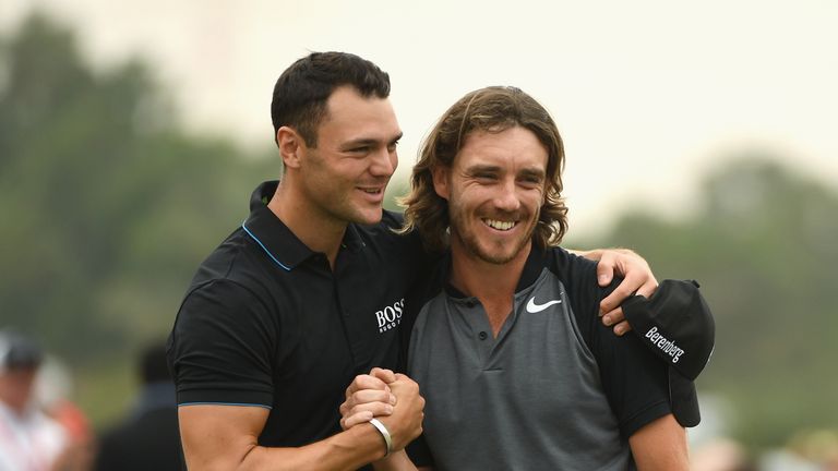 ABU DHABI, UNITED ARAB EMIRATES - JANUARY 22:  Tommy Fleetwood of England is congratulated by Martin Kaymer of Germany on the 18th green during the final r