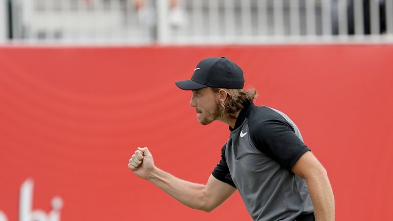 ABU DHABI, UNITED ARAB EMIRATES - JANUARY 22:  Tommy Fleetwood of England celebrates holing the winning putt on teh 18th green during the final round of th