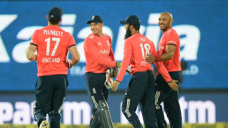 Tymal Mills (R) took his first international wicket in England's win (Credit: AFP)