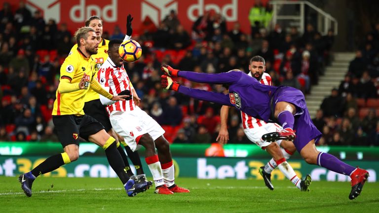 STOKE ON TRENT, ENGLAND - JANUARY 03: Heurelho Gomes of Watford dives for the ball during the Premier League match between Stoke City and Watford at Bet365