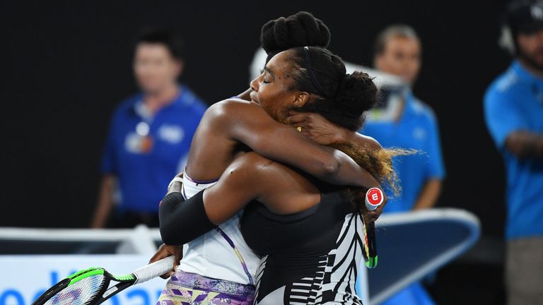 MELBOURNE, AUSTRALIA - JANUARY 28:  Serena Williams of the United States is congratulated by Venus Williams of the United States after winning the Women's 