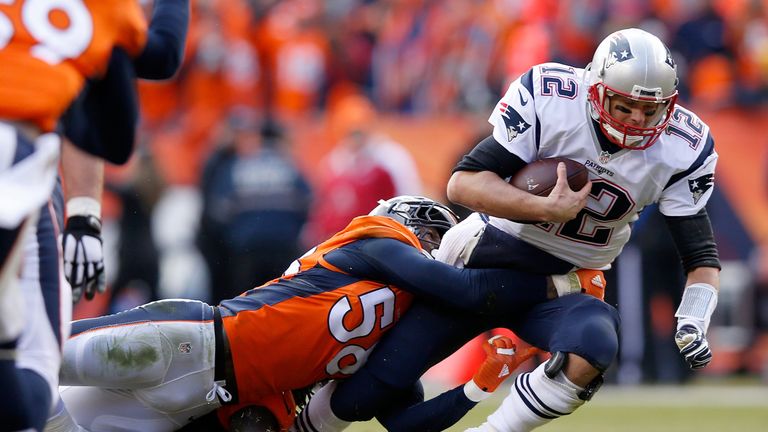 DENVER, CO - JANUARY 24:  Tom Brady #12 of the New England Patriots is sacked by  Von Miller #58 of the Denver Broncos in the second quarter in the AFC Cha