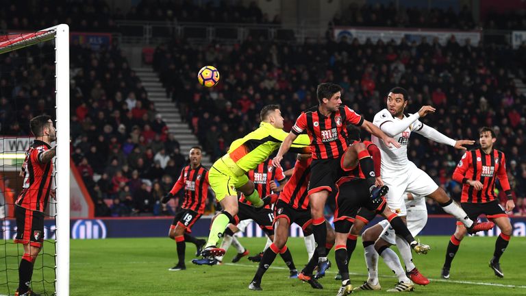 BOURNEMOUTH, ENGLAND - JANUARY 21:  Troy Deeney of Watford (R) scores his sides second goal with a header during the Premier League match between AFC Bourn