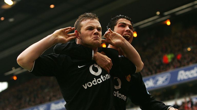 LIVERPOOL, ENGLAND - JANUARY 15:  Wayne Rooney and team mate Cristiano Ronaldo of Manchester United respond to Liverpool fans after Rooney scored during th