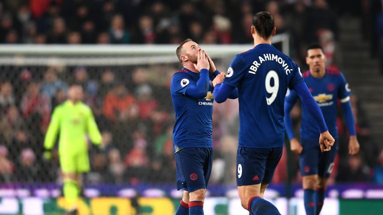Wayne Rooney celebrates becoming Manchester United's all-time leading goalscorer