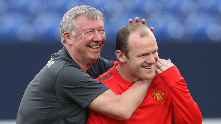 Sir Alex Ferguson and Wayne Rooney sharea a joke during a Champions League training session