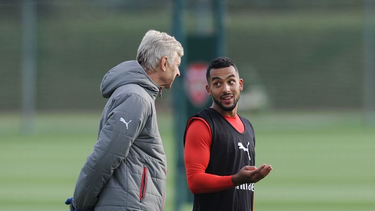 Arsene Wenger (left) has been showing how much he wants the Premier League title, according to Theo Walcott