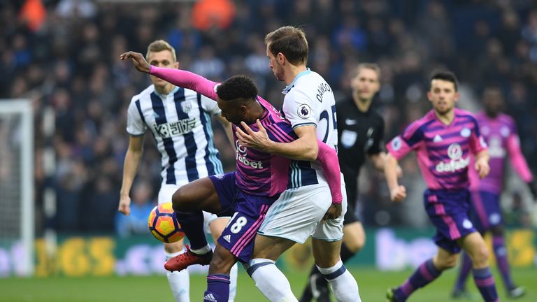 WEST BROMWICH, ENGLAND - JANUARY 21: Jermain Defoe of Sunderland (L) is put under pressure from Craig Dawson of West Bromwich Albion (R) during the Premier