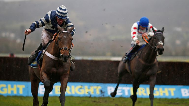Davy Russell riding Whisper (L) clear the last to win the BetBright Dipper Novices' Chase from Clan Des Obeaux 