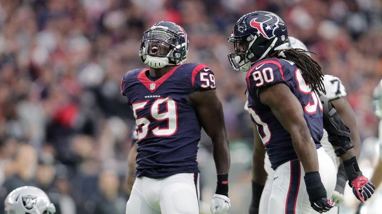 HOUSTON, TX - JANUARY 07:  Whitney Mercilus #59 of the Houston Texans celebrates a tackle during the first quarter against the Oakland Raiders in their AFC