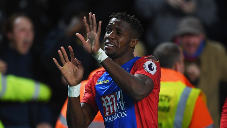 HULL, ENGLAND - DECEMBER 10:  Wilfried Zaha of Crystal Palace dances in celebration as he scores their second goal during the Premier League match between 