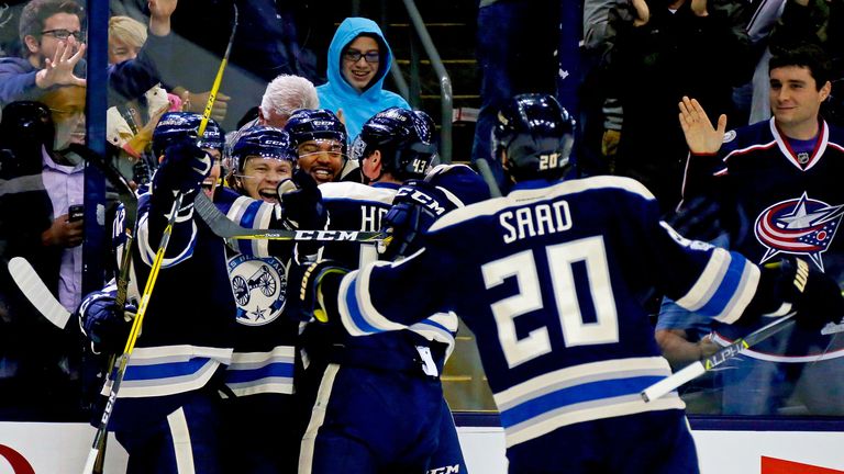 COLUMBUS, OH - JANUARY 3:  William Karlsson #25 of the Columbus Blue Jackets is congratulated by his teammates after scoring a power play goal during the s