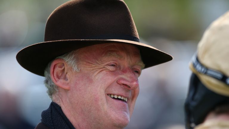 ESHER, ENGLAND - 23 APRIL: Trainer Willie Mullins looks on in the parade ring ahead of the first race at Sandown racecourse on April 23, 2016 in Esher, Eng