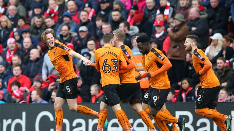 LIVERPOOL, ENGLAND - JANUARY 28:  Richard Stearman (1st L) of Wolverhampton Wanderers celebrates scoring the opening goal with his team mates during the Em