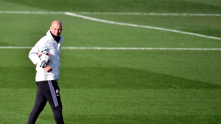 Real Madrid's French coach Zinedine Zidane looks on during a training session