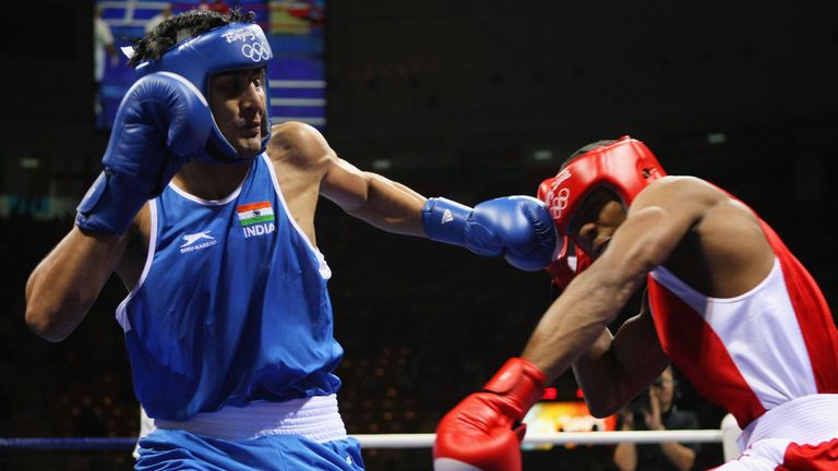 BEIJING - AUGUST 09:  Vijender Kumar (L) of India lands a left on Badou GJ Jack (R) of Gamba in the Men's Middleweight bout during the boxing event held at