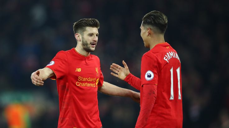 LIVERPOOL, ENGLAND - FEBRUARY 11: Adam Lallana of Liverpool celebrates with Roberto Firmino after the Premier League match between Liverpool and Tottenham 