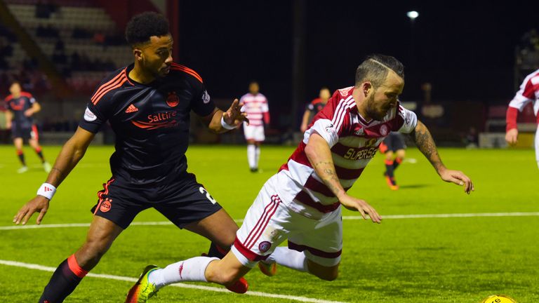 Aberdeen's Shay Logan and Hamilton's Dougie Imrie in action at the Superseal Stadium