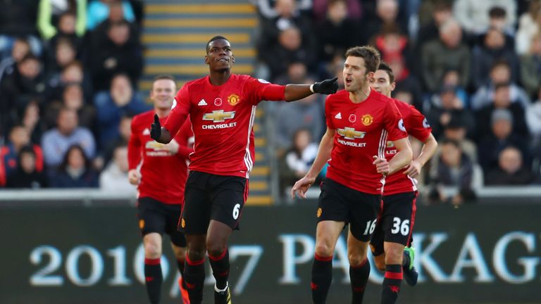NOVEMBER 06 2016: Paul Pogba of Manchester United celebrates with Michael Carrick after scoring in the Premier League match against Swansea