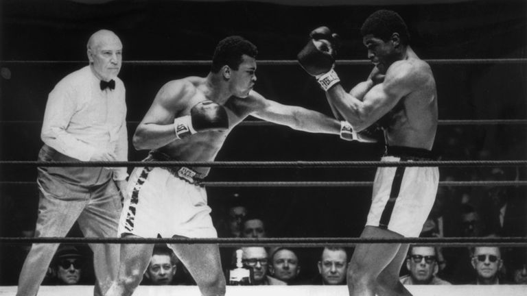 6th February 1967:  Muhammad Ali delivers a crashing left to Ernie Terrellfs body during their 15-round contest in the Astrodome, Houston, Texas. The fight