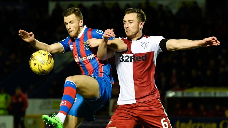 Inverness' Liam Polworth (left) with Danny Wilson (right) of Rangers jostle for the ball